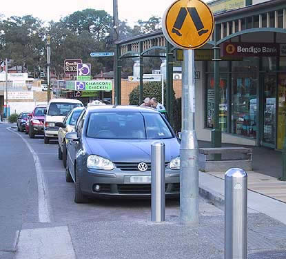 Stainless steel bollards at pedestrian crossing